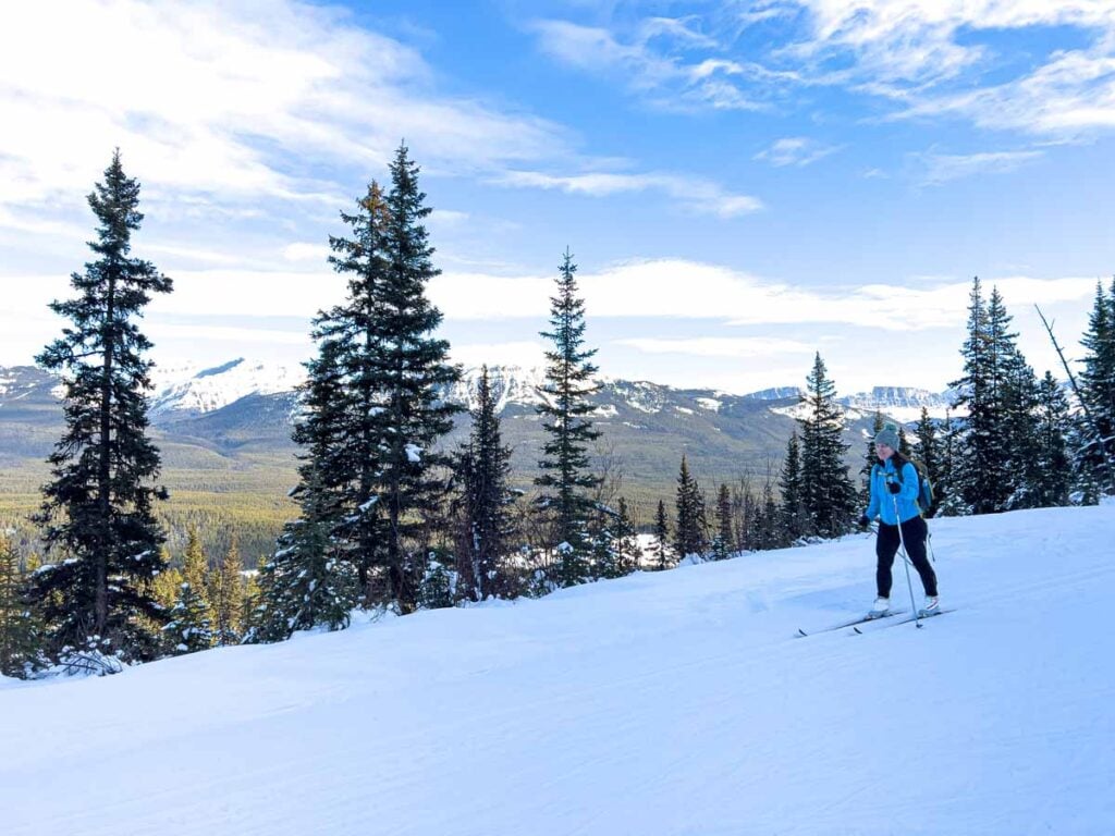Celine Brewer cross-country skis a scenic section of the Moraine Lake Road cross-country ski trail near Lake Louise.