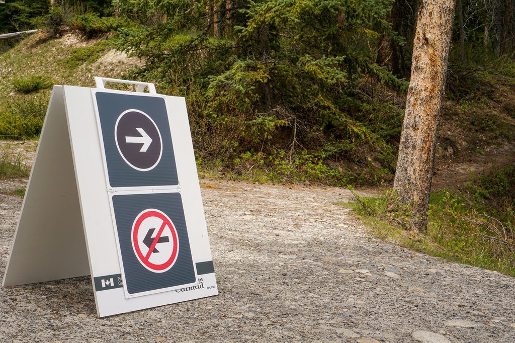 To promote social distancing, Parks Canada has installed many one-way signs along the Johnson Lake Trail in Banff National Park