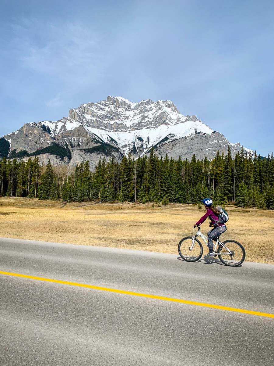 Lake Minnewanka Loop Cycle - Road Cycling in Banff Cycling Lake Minnewanka Loop Road with Cascade Mountain in background