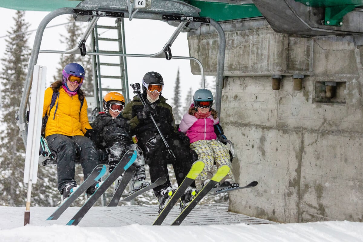 Family on chairlift at Lake Louise Ski Resort - Banff Skiing