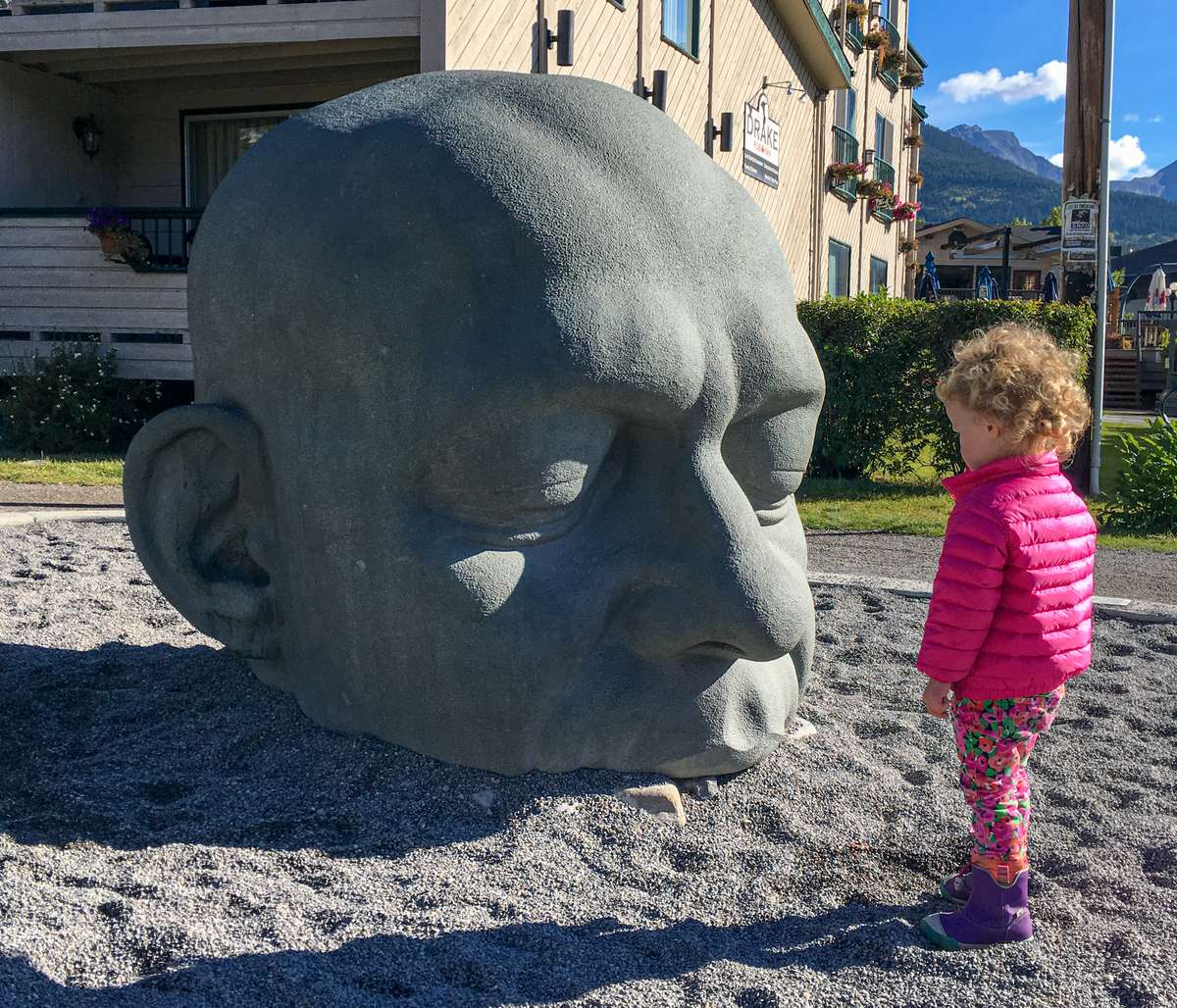 Visiting the Big Head sculpture is a fun thing to do in Canmore with kids.