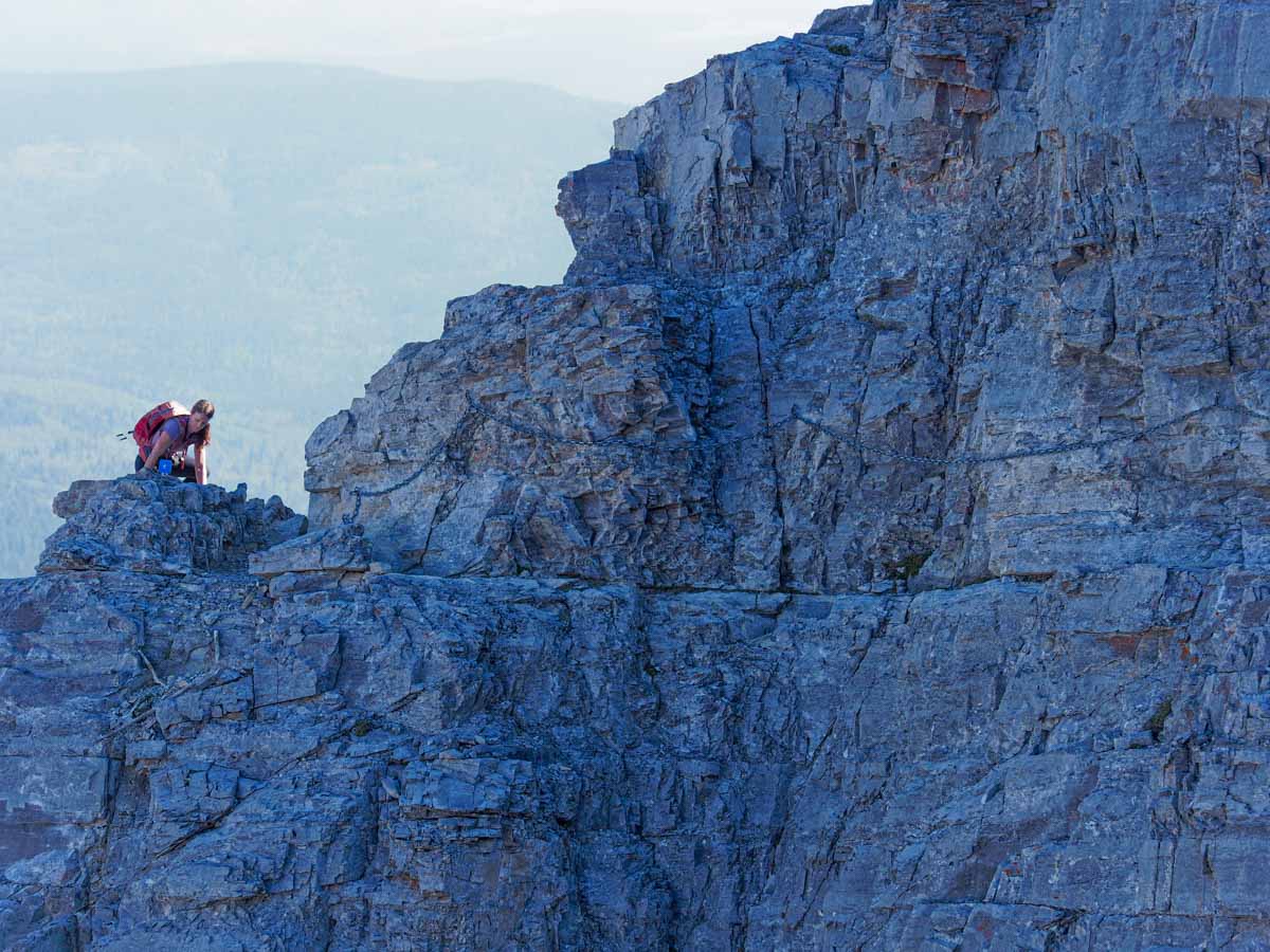 A woman hiker nears the chain section on the Mount Yamnuska hike