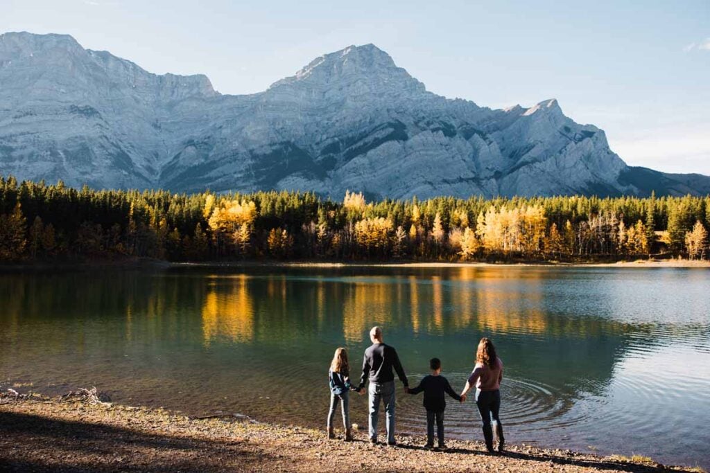 The Brewer family on a Flytographer photo shoot at Wedge Pond in fall.