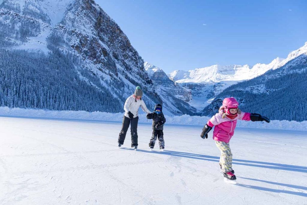 Celine Brewer and her kids enjoy ice skating on the maintained ice rink at Lake Louise.