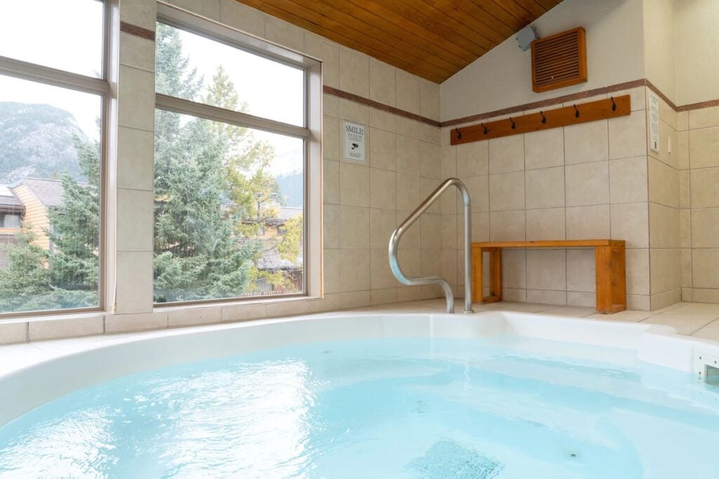 mountain views from the indoor hot tub at the Red Capet Inn in downtown Banff.