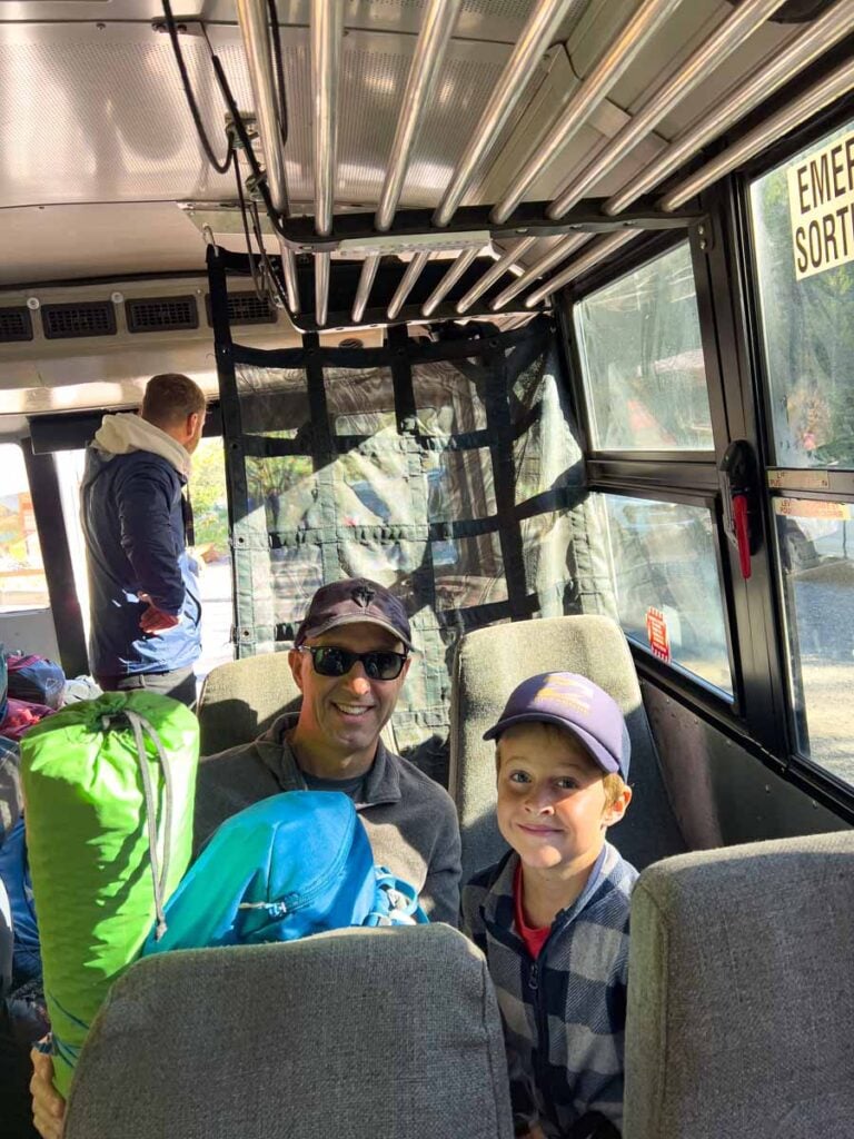 Dan Brewer and his son are on the shuttle bus to the Lake O'Hara campground.