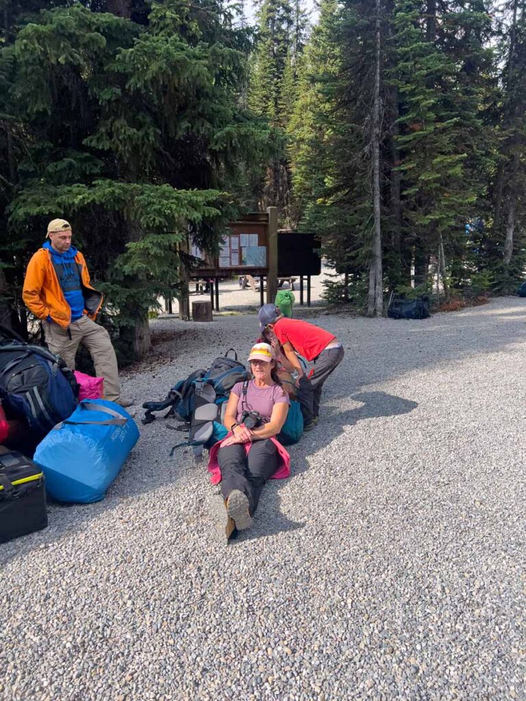 Celine Brewer waits for her shuttle bus at the end of her camping trip to Lake O'Hara.
