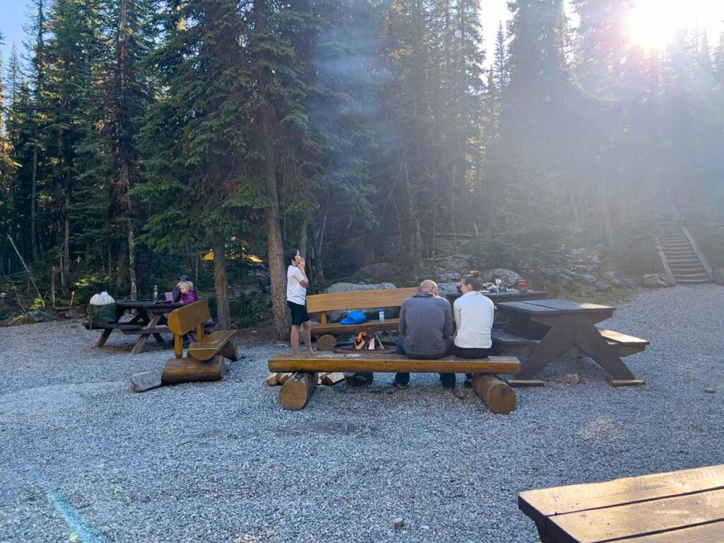 A fire burns in the communal firepit at the Lake O'Hara campground in Yoho National Park.