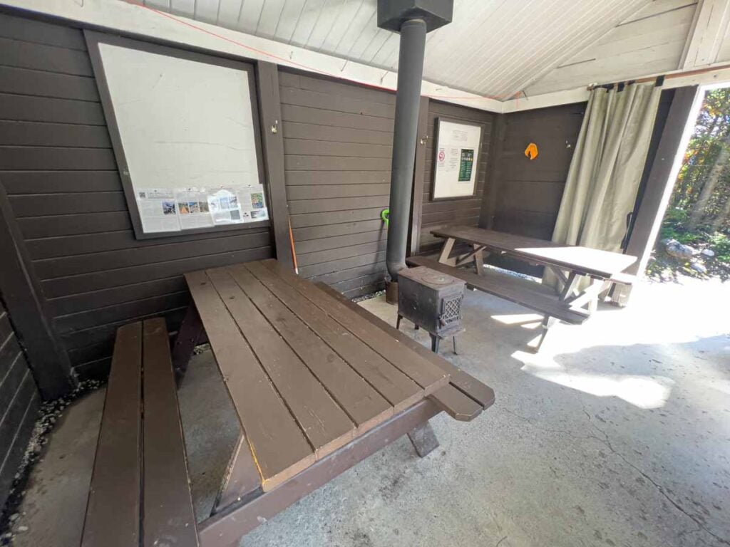 The inside of a covered cooking shelter at the Lake O'Hara campground in Yoho National Park.