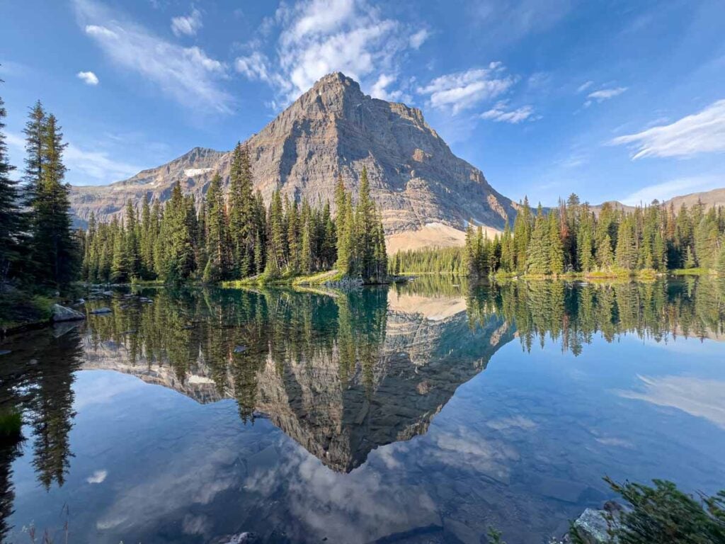 Odaray Mountain is reflected off the still waters of Linda Lake at Lake O'Hara.