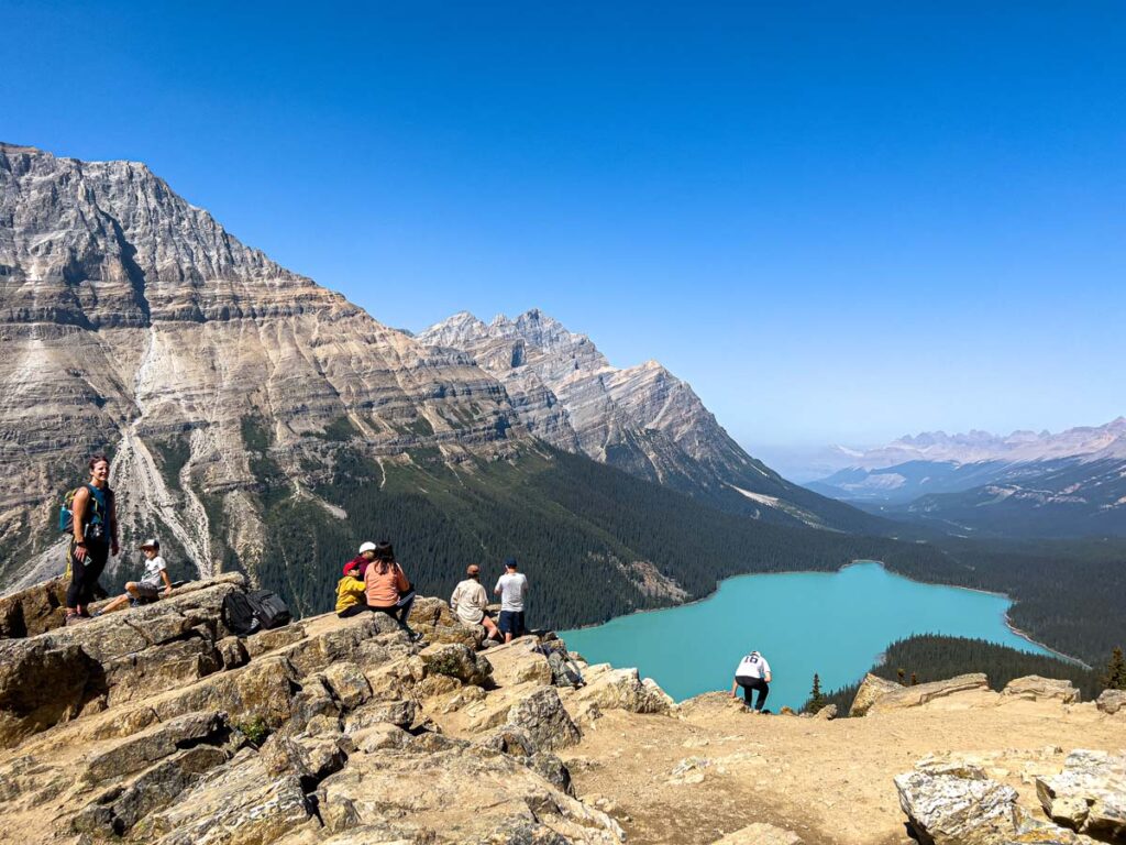 A group of hikers in Banff National Park enjoy vistas of Caldron Peak and Peyto Lake.