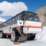 Ice Explorer Vehicle - Columbia Icefield Adventure Tour An Ice Explorer all-terrain vehicle on top of the Athabasca Glacier on a Columbia Icefield Adventure Tour.