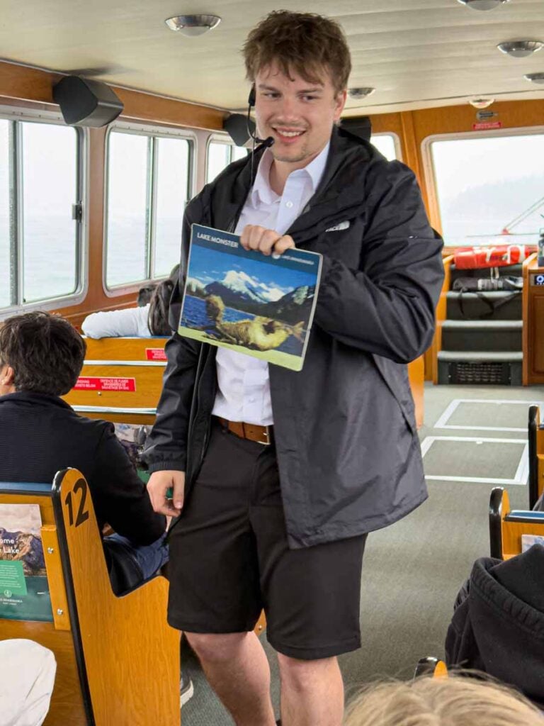 Our Lake Minnewanka Cruise guide shows us a photo of the famous Lake Monster.