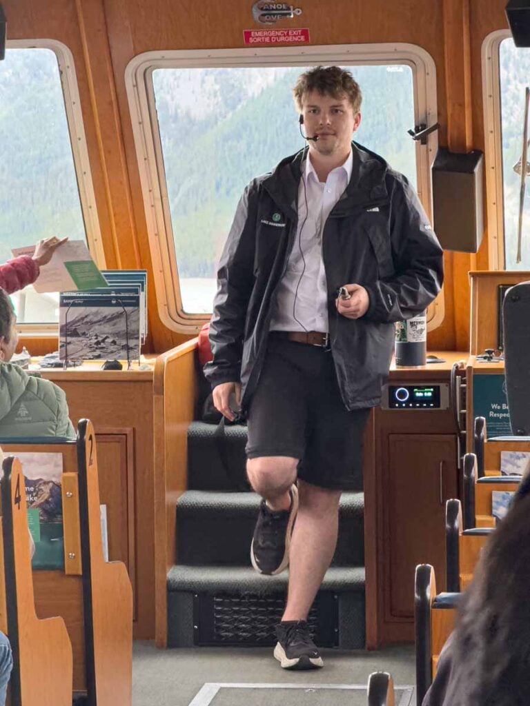 One of the guide's on the Lake Minnewanka Cruise shares stories about the area.