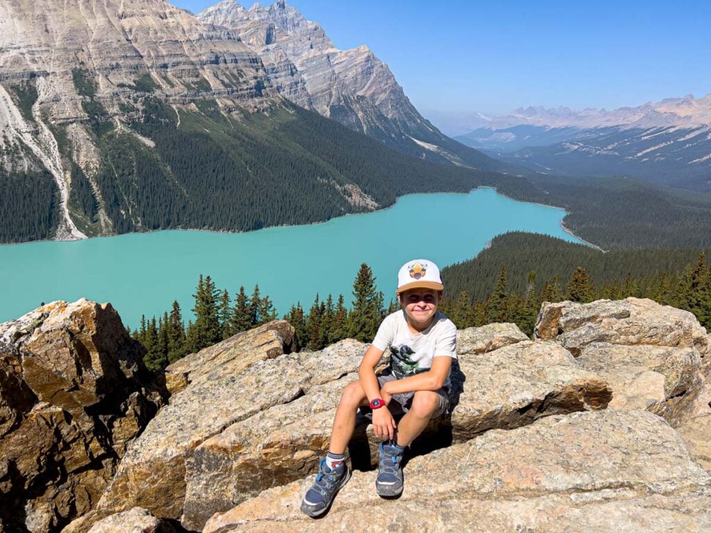 A young boy enjoys views of Peyto Lake in Banff National Park.