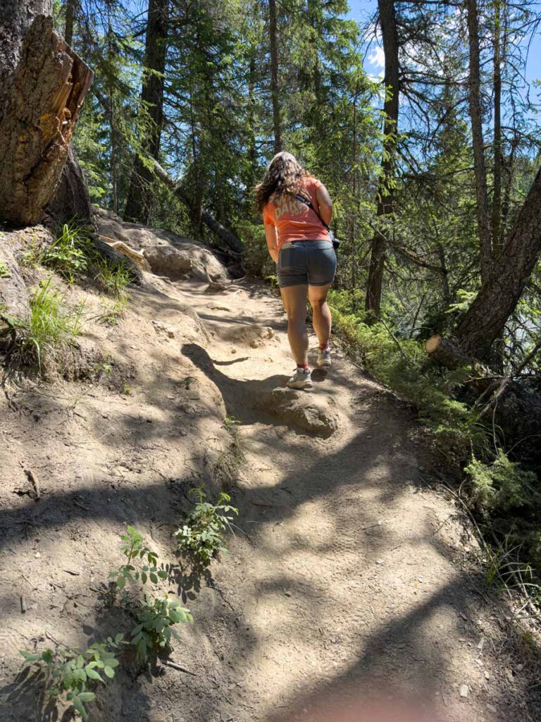 Celine Brewer, owner of TravelBanffCanada.com, hikes back up the steep hiking trail at Wapta Falls.