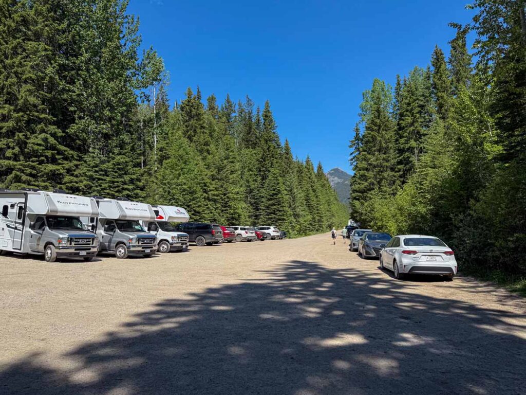 Vehicles parked in the summer Wapta Falls Parking lot.