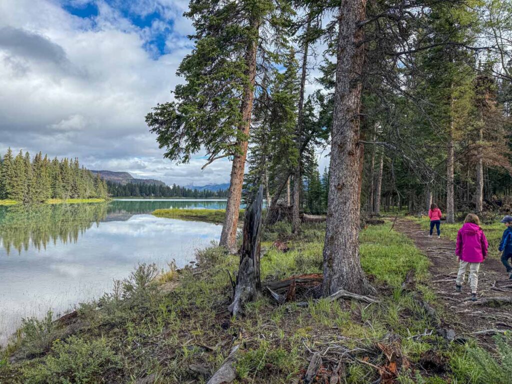 Celine Brewer, owner of the Travel Banff Canada blog, enjoys an easy walk in Jasper at Edith Lake.