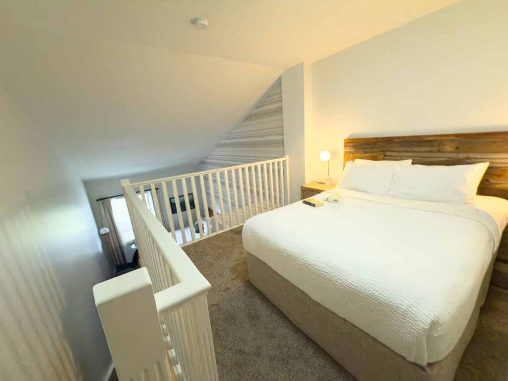The Queen bed found in the loft in a Deluxe Loft room at the Glacier View Lodge.