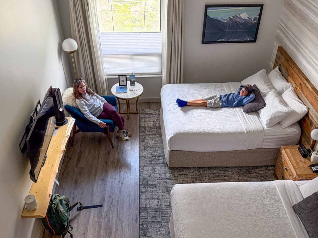 Celine Brewer, owner of TravelBanffCanada.com, relaxes in her Deluxe Loft room with her son during a stay at the Glacier View Lodge in Jasper National Park.