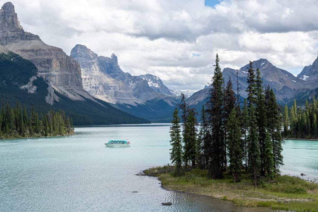 A Maligne Lake Cruise boat approaches Spirit Island in Jasper National Park.