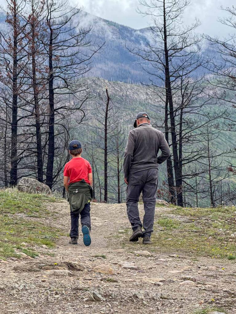 Dan Brewer, owner of TravelBanffCanada.com, walks with his son on the Old Fort Point Loop hiking trail near Jasper.