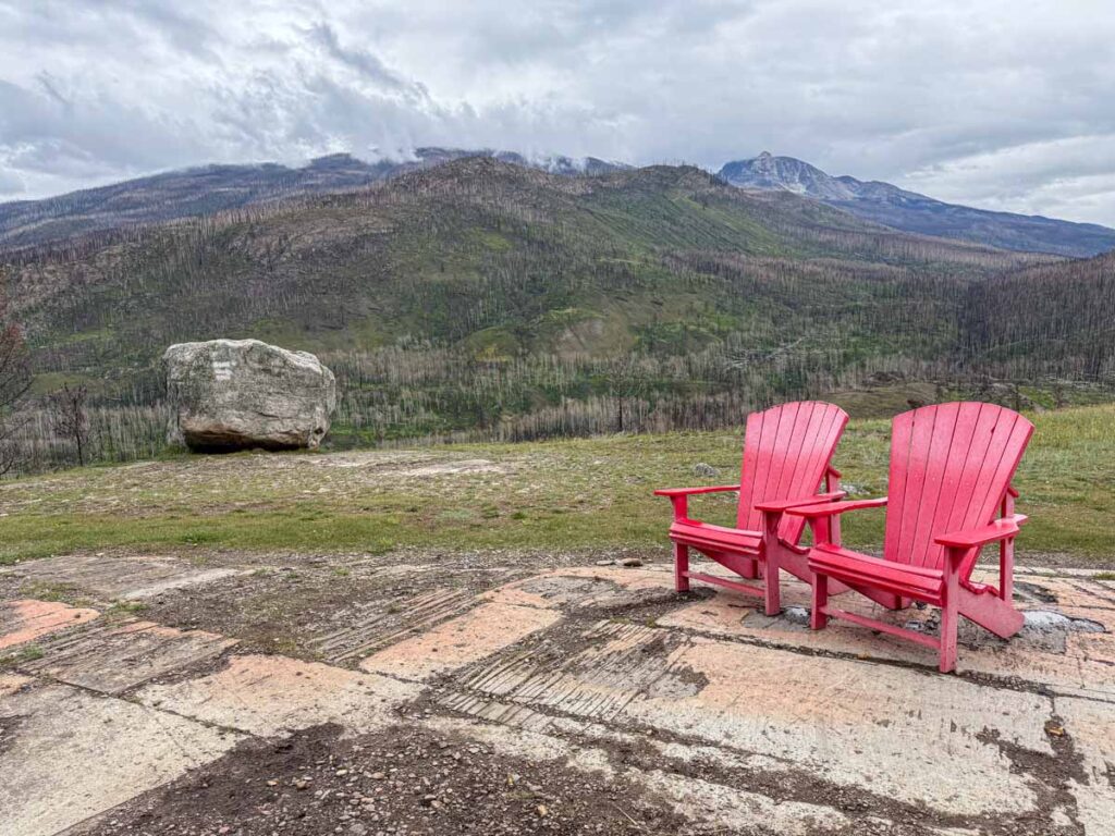 Two iconic Parks Canada red chairs on the Old Fort Point Trail in Jasper National Park.