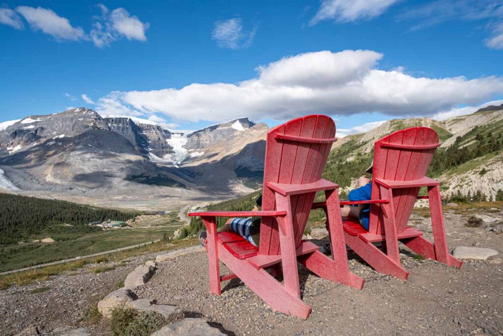 Parks Canada red chairs on Wilcox Pass overlooking the Athabasca Glacier.
