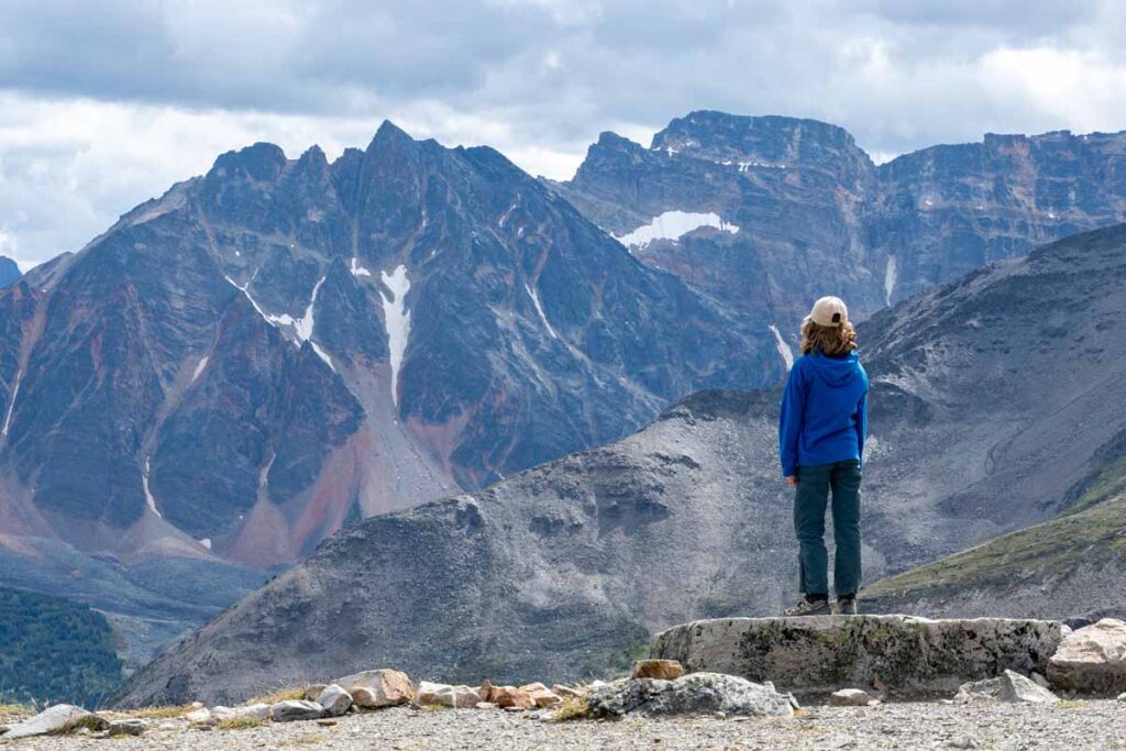 a 12 year old girl admires Terminal Mountain after riding the Jasper SkyTram with her family.