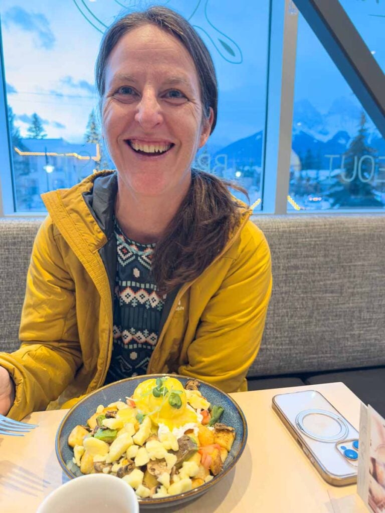 Celine Brewer, owner of TravelBanffCanada.com, enjoys a laugh during breakfast at the Bro'Kin Yolk breakfast restaurant in Canmore.