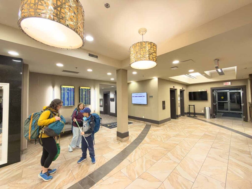 Celine Brewer, owner of TravelBanffCanada..com, in the lobby of the Acclaim Calgary Airport Hotel with her kids.