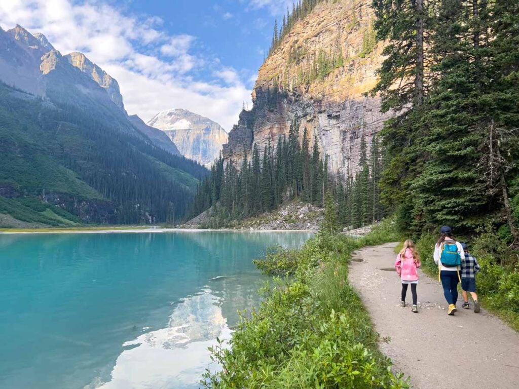 Celine Brewer, owner of TravelBanffCanada.com, enjoys an easy walk along the Lake Louise lakeshore trail with her kids.