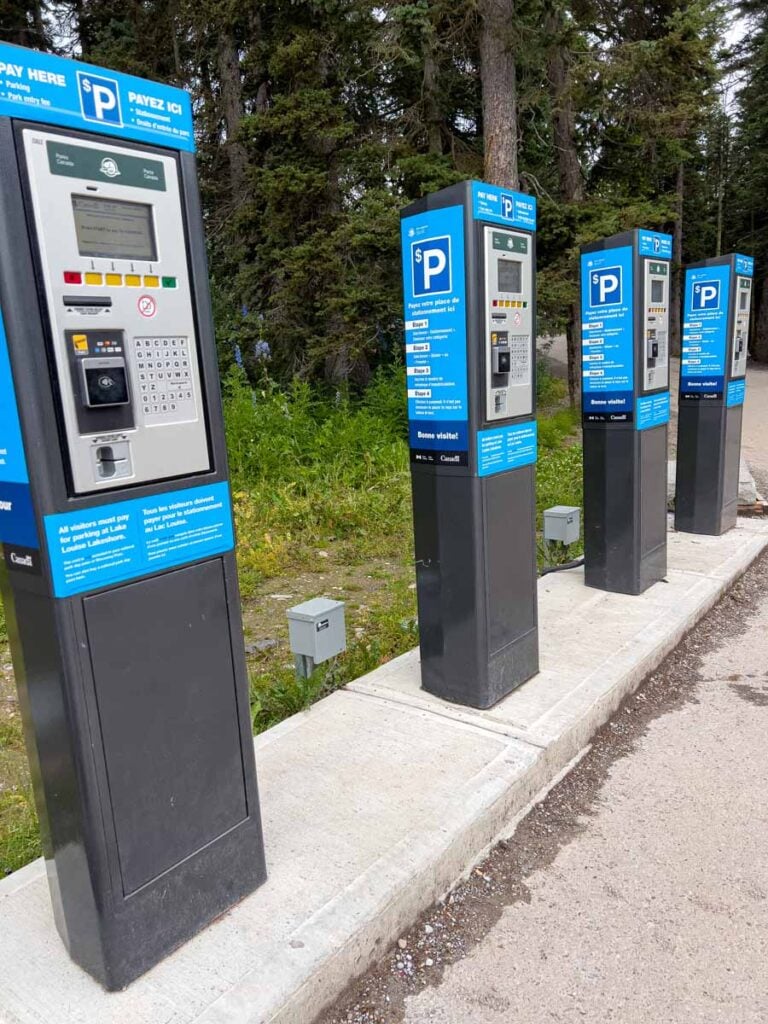 Pay parking stations in the Lake Louise lakeshore parking lot.