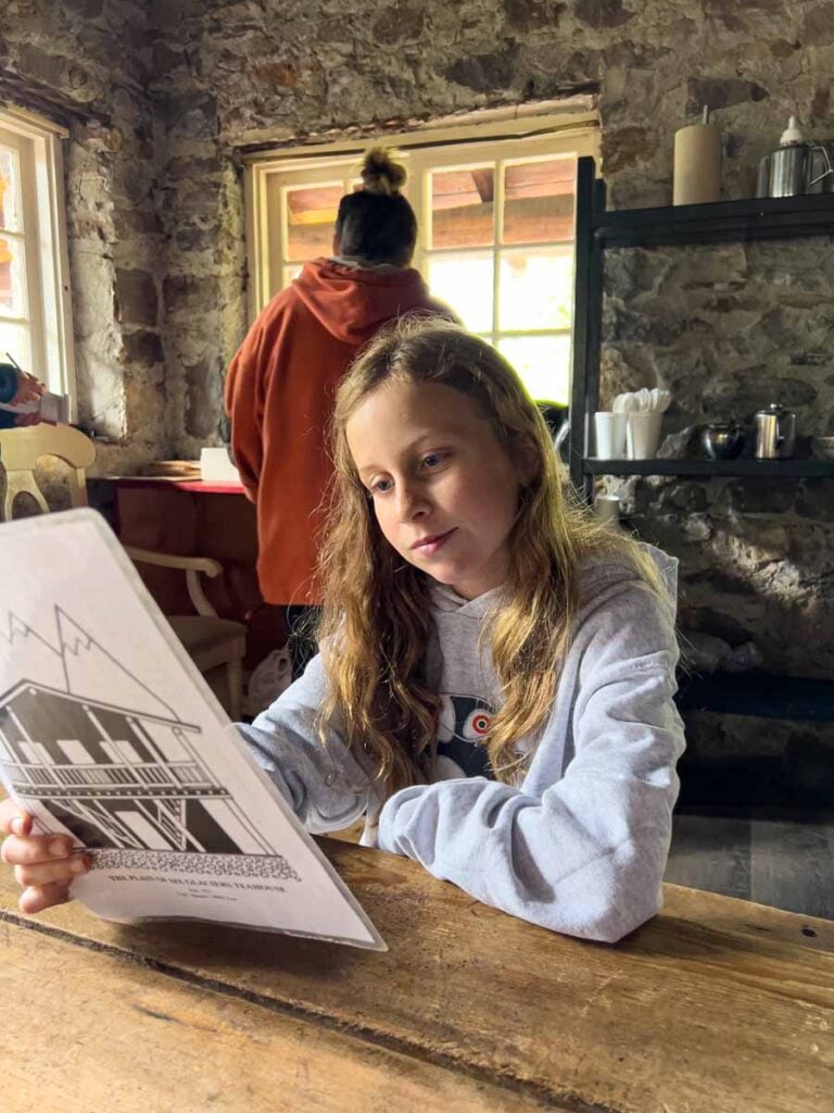 one of the Brewer kids looks at the menu at the Plain of Six Glaciers Teahouse.