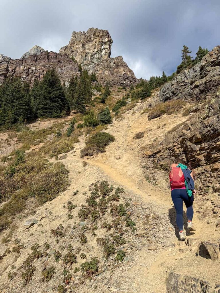 Celine Brewer hikes a steep leg of the Devil's Thumb Trail near Lake Louise.