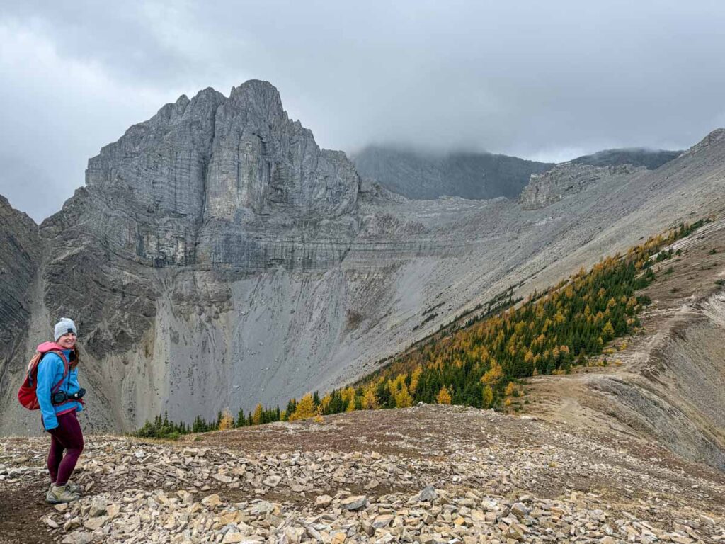 Celine Brewer stands beneath The Fist mountain near the weather station on the Tent Ridge Trail.