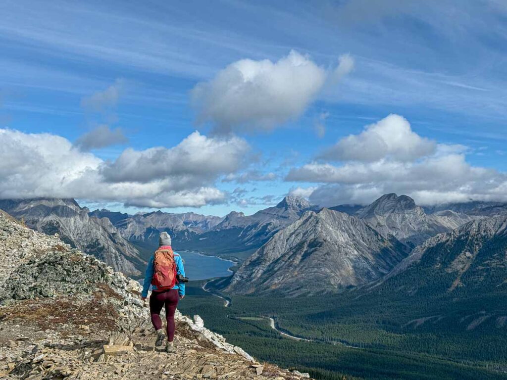 Celine Brewer soaks in views of the Spray Lakes while descending the Tent Ridge Trail.