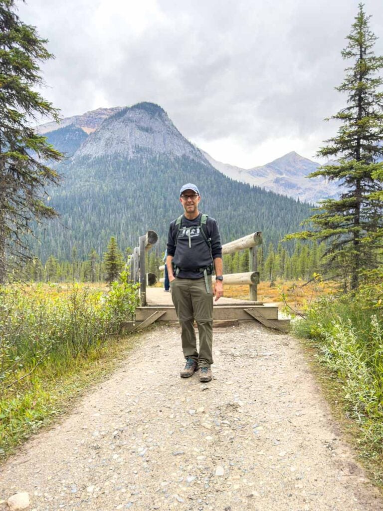 Dan Brewer, owner of TravelBanffCanada.com, stands by the bridge over the Emerald River.
