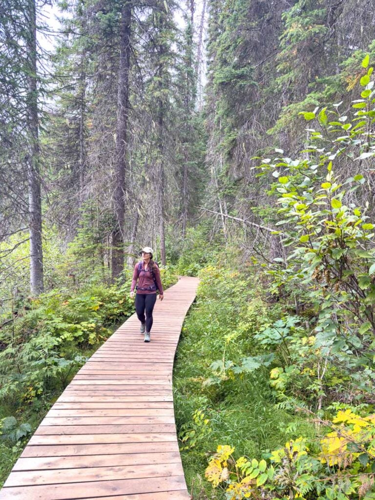 Celine Brewer walks on a new wooden boardwalk on the hiking trail around Emerald Lake.