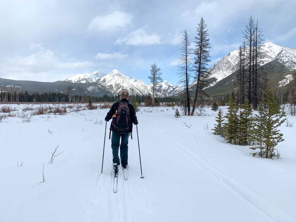 Dan Brewer enjoys wide mountain views from the Bill Milne cross-country ski trail in Kananaskis Country.