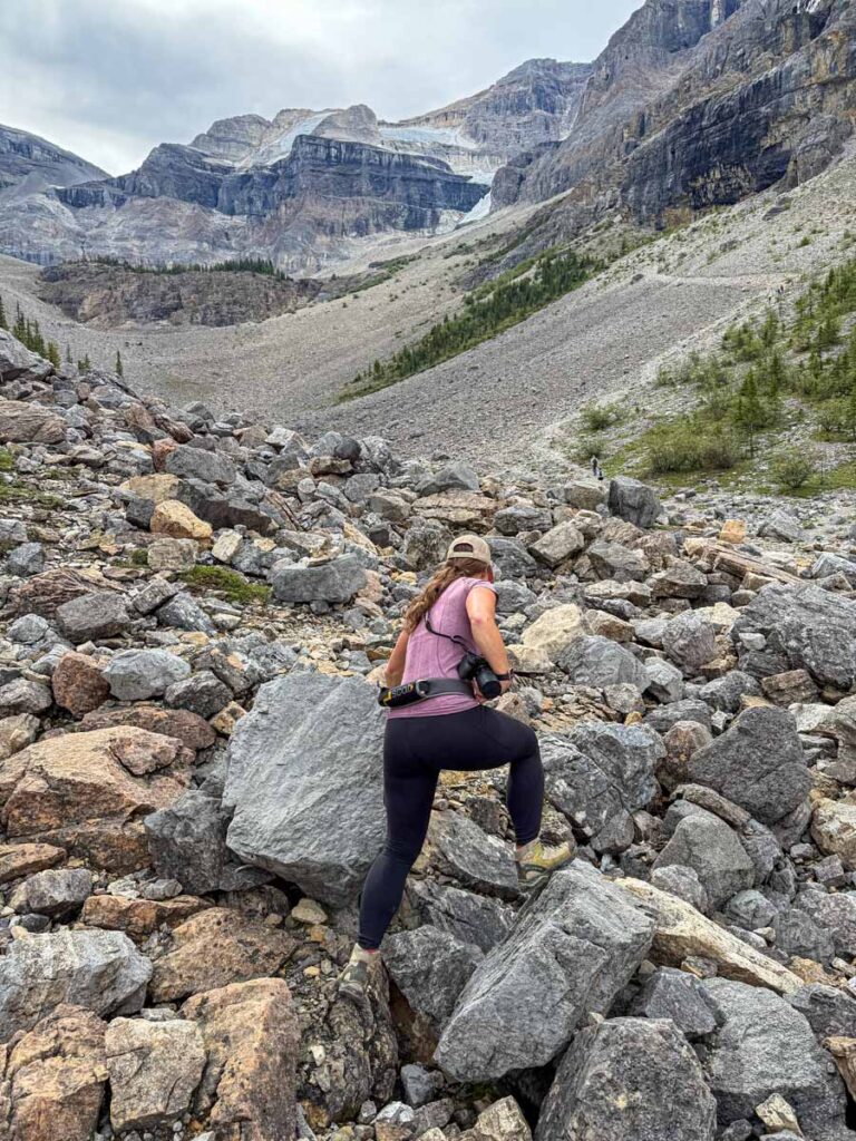 Celine Brewer takes a big step on a large rock during a very steep section of the Stanley Glacier Trail in Kootenay National Park.