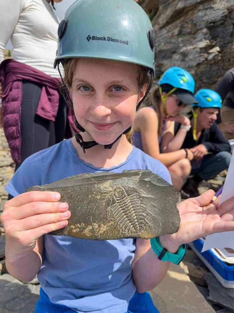 One of the Brewer kids holds a fossil from the Burgess Shale Walcott Quarry in Yoho National Park.