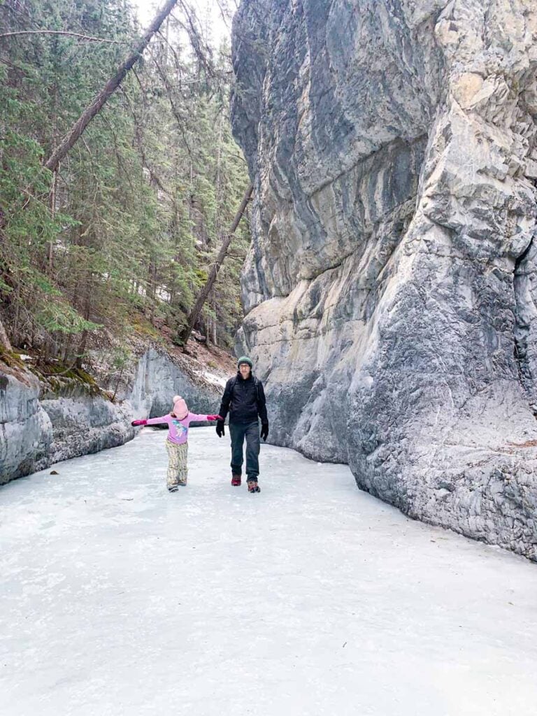 Dan Brewer and his daughter enjoy walking on the ice in the Grotto Canyon ice walk in Kananaskis Country.
